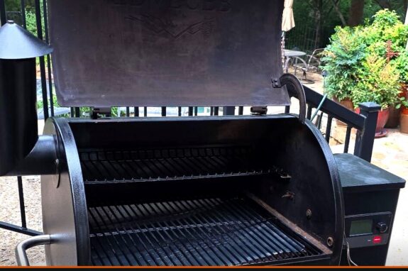 Traeger pellet grill with the lid open showing cleaned grates and interior