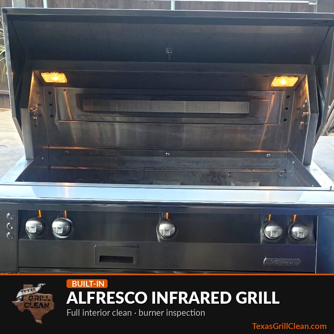 Alfresco built-in gas grill with the lid open after a professional deep cleaning