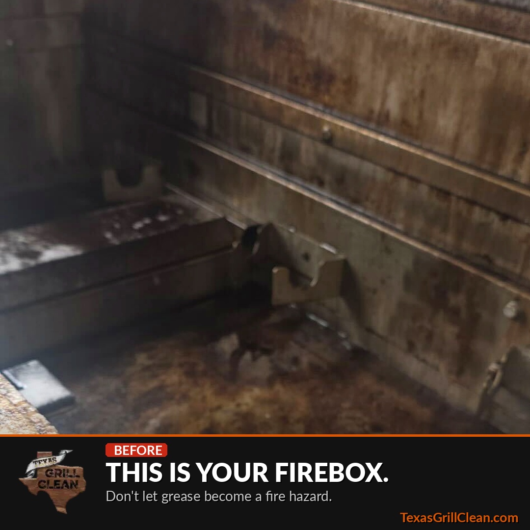 Grill firebox before cleaning, showing heavy grease and carbon buildup