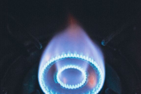 Close-up of a healthy blue gas burner flame, showing correct complete combustion