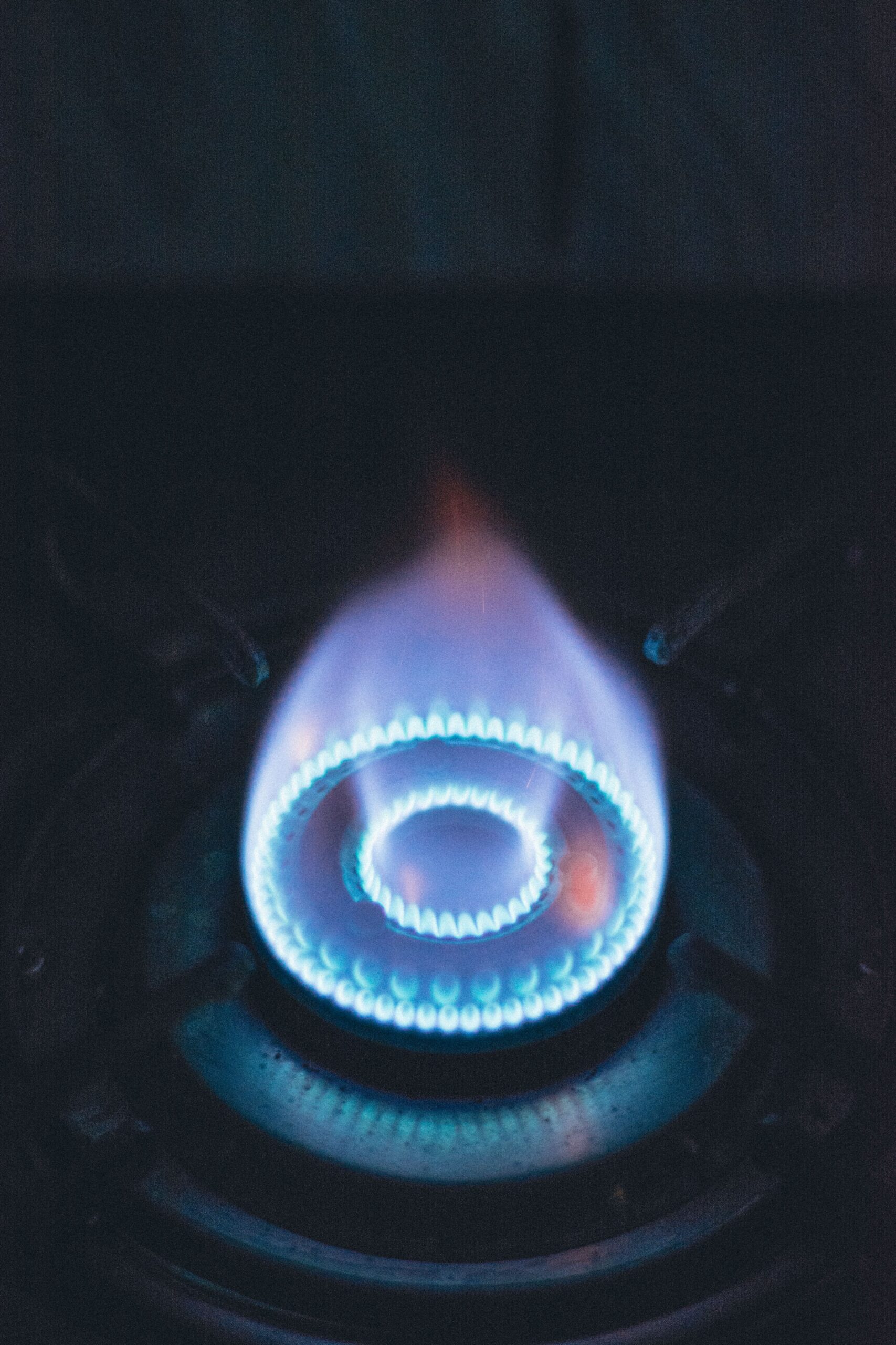 Close-up of a healthy blue gas burner flame, showing correct complete combustion