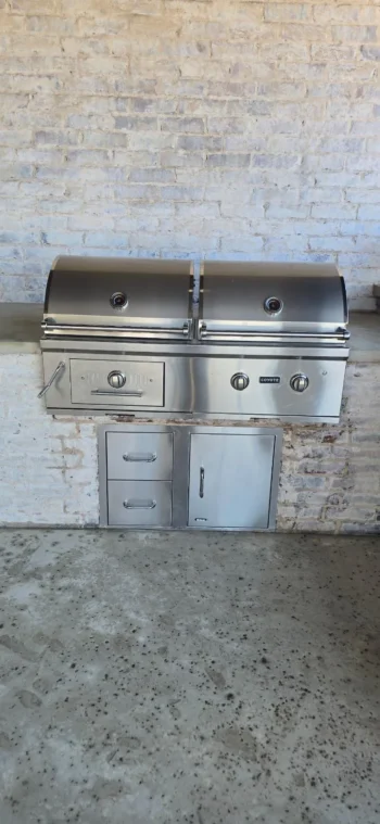 Outdoor kitchen built-in grill with stainless doors and drawers after cleaning, Dallas-Fort Worth